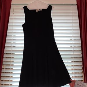 Simple sleeveless black knit dress